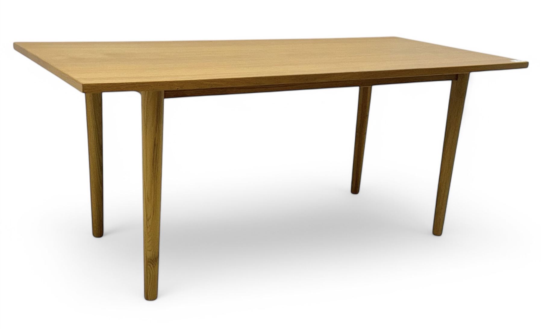 Ikea - Rectangular oak table, slim rectangular top over rounded edges, supported by tapered cylindrical legs  