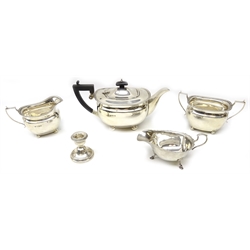  Silver three piece tea set by Elkington Birmingham 1938, a sauce boat approx 35oz gross and a weighted candlestick  