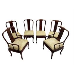 Mid to late 20th century Chinese hardwood extending dining table, two additional leaves, shaped apron carved with foliate scrolls, leaf carved cabriole supports (W246cm, H78cm, D117cm), and set six (4+2) dining chairs with shaped cresting rails over carved splats