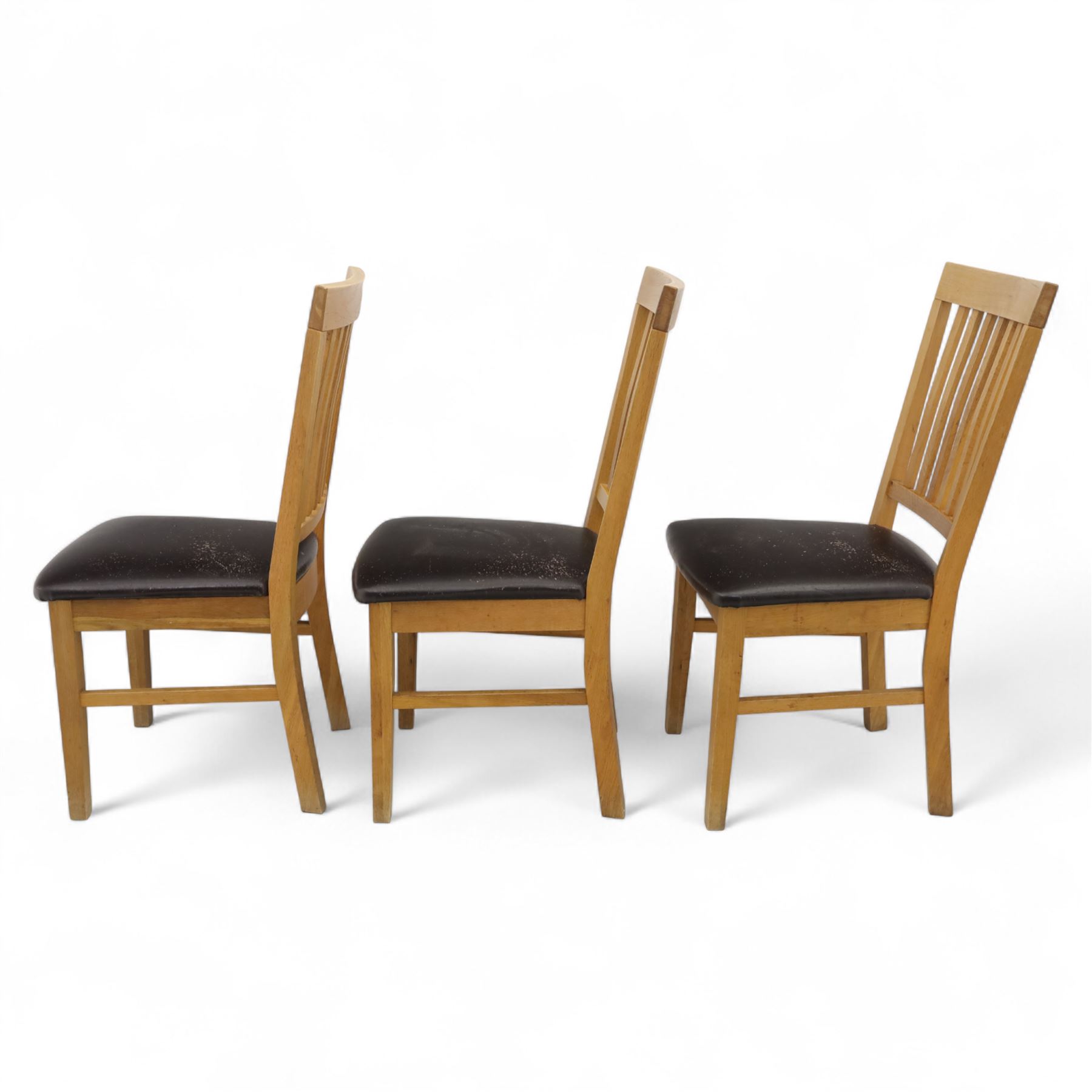 Contemporary set of six light oak dining chairs with faux leather cushion seats 