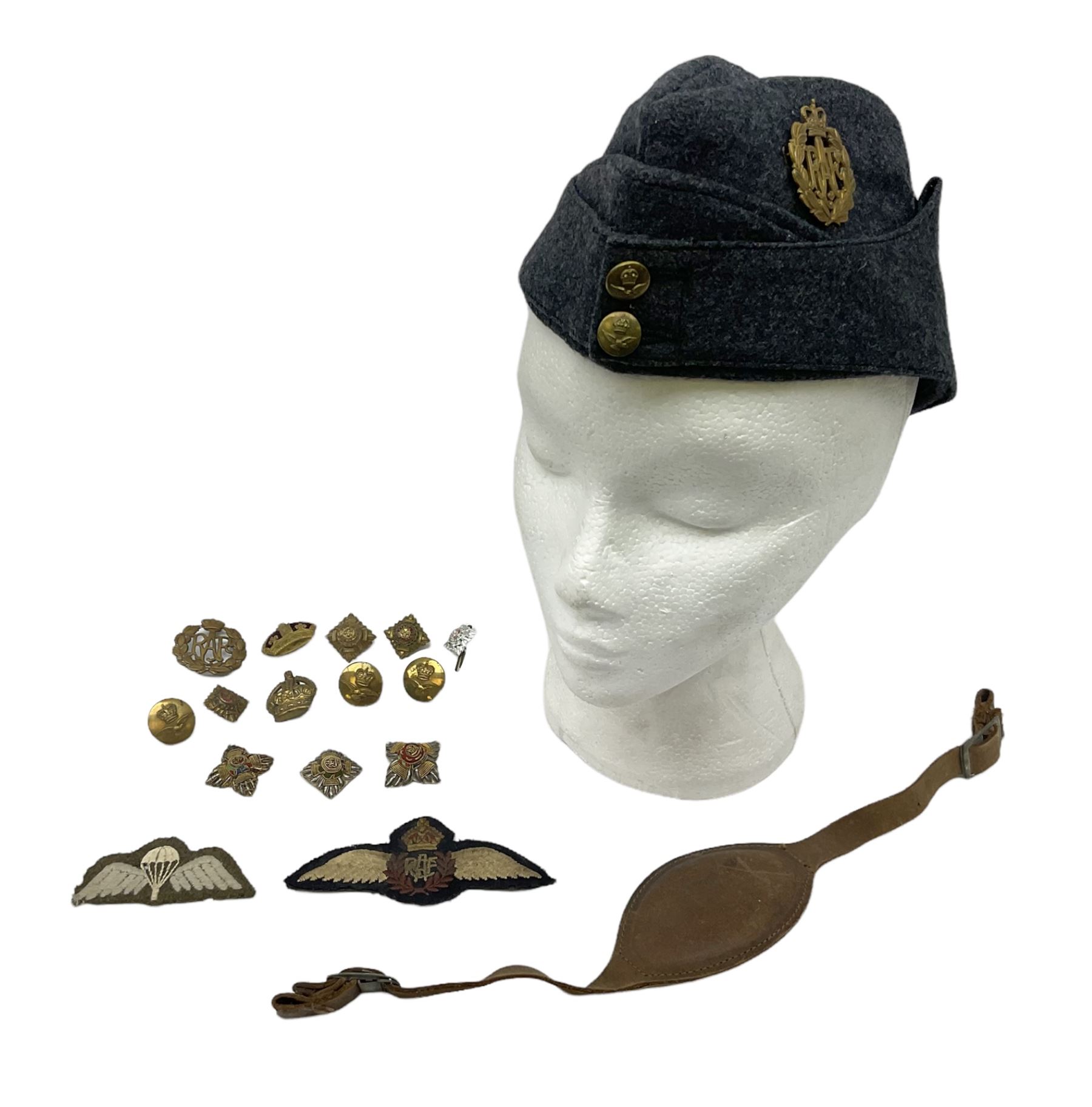 WW2 RAF sidecap dated 1942 with badge and buttons; quantity of RAF metal and cloth badges, pips and buttons; and paratrooper's helmet chin strap