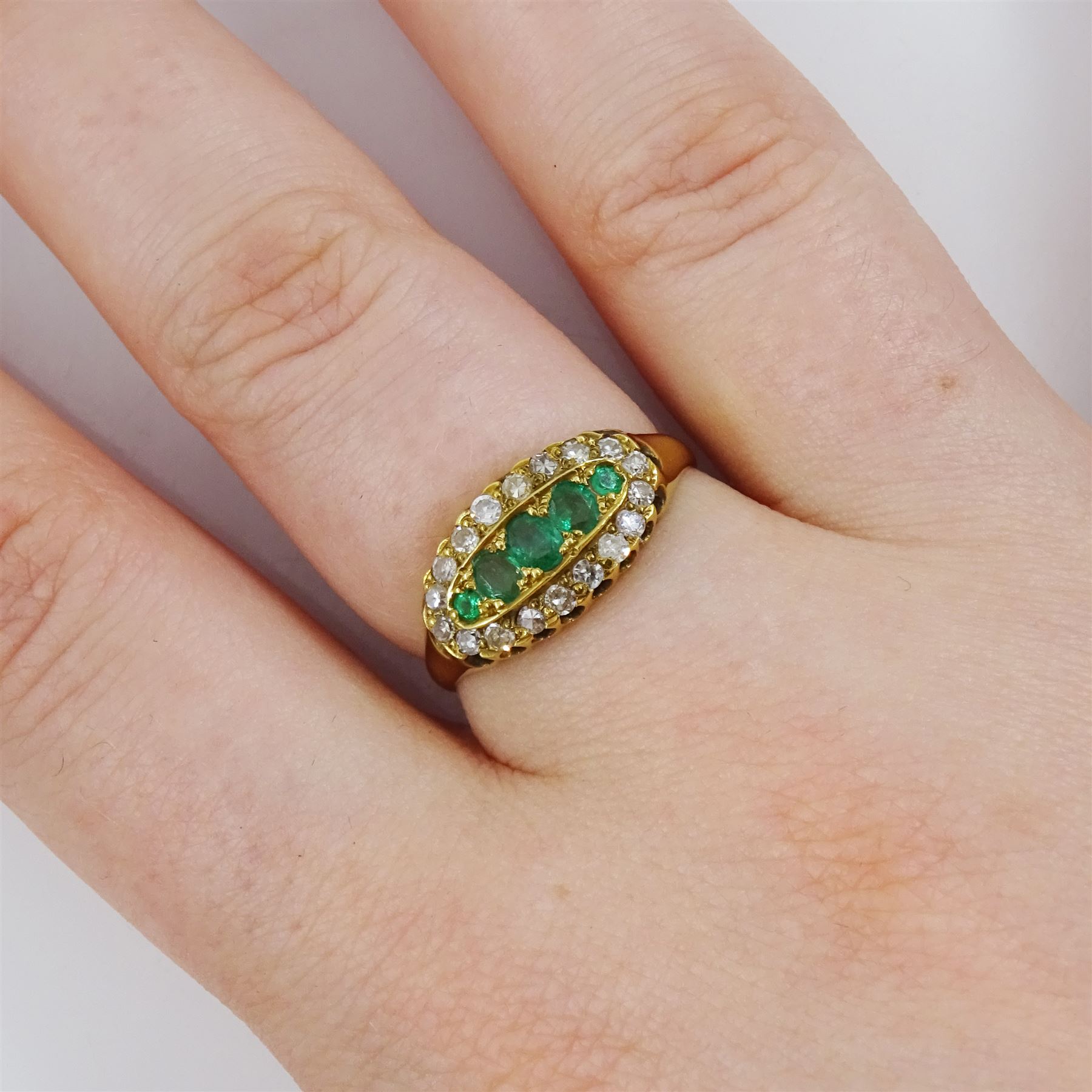 Early 20th century emerald and single cut diamond, navette shaped ring, stamped 18ct