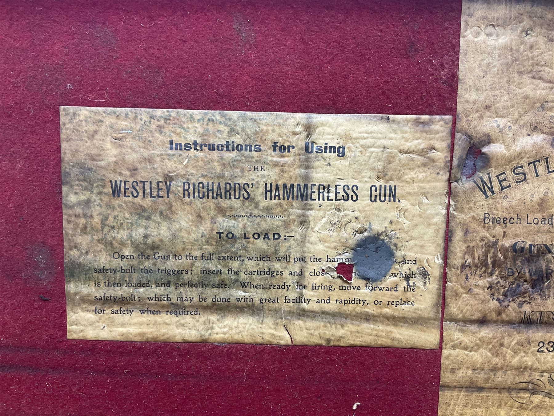 Leather shotgun case, the red baize lined interior with the trade labels of Westley Richards & Co., London, a brass plaque inscribed 'T Nevin, Mirfield, Yorkshire' to cover, with key, case to fit barrel 76cm (30 inches)  
