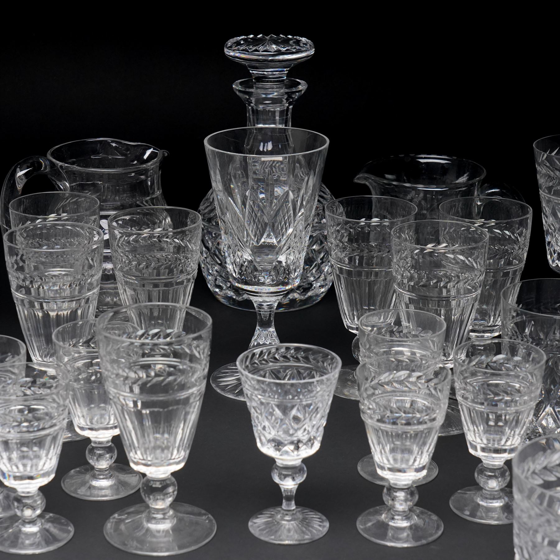 Quantity of Stuart crystal including six Cheltenham whisky tumblers, six claret glasses, six water tumblers and decanter with similar Stuart glass including sherry glasses, two brandy balloons, water jug etc