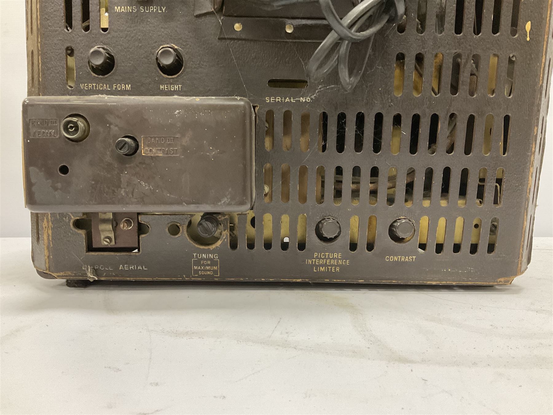 1950s Bush Type TV22 Bakelite Television receiver, the TV cased in marbled brown Bakelite of stepped form, the 9 inch screen with white mask, with original leather cover casing to reverse, H39cm D34cm W38cm