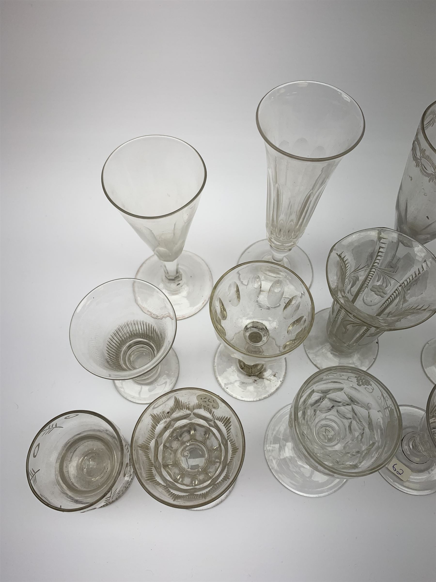 A group of early 19th century and later drinking glasses, to include two toastmaster type examples with deceptive bowls, together with a Bonnet glass or monteith, probably late 18th century. 