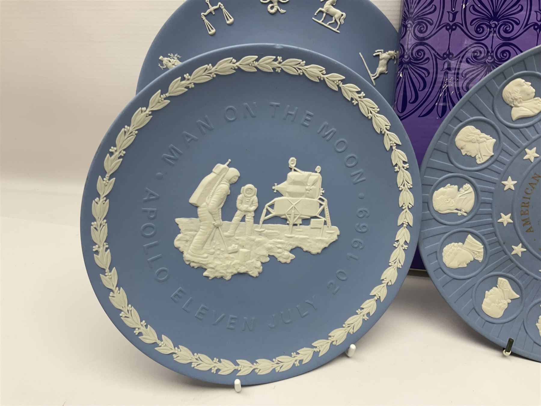 Collection of Wedgwood Jasperware, to include black Eisenhower Bust, two black basalt paperweights, one depicting an eagle and one depicting Julius Caesar, a blue Zodiac plate, Man on the Moon commemorative plate, American Independence Bicentennial plate and Royal commemorative ware, etc, all with impressed marks beneath, some with boxes