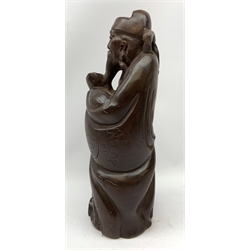RTV A carved Chinese hardwood figurine, modelled as a sage, H41cm.   