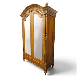 And So To Bed - French design ‘Eclectic’ double wardrobe in light finish, arched moulded cornice with carved foliate band and turned finials, two mirrored doors enclosing a hanging rail, flanked by turned columns with foliate decoration, single fluted drawer below, on turned tapering feet