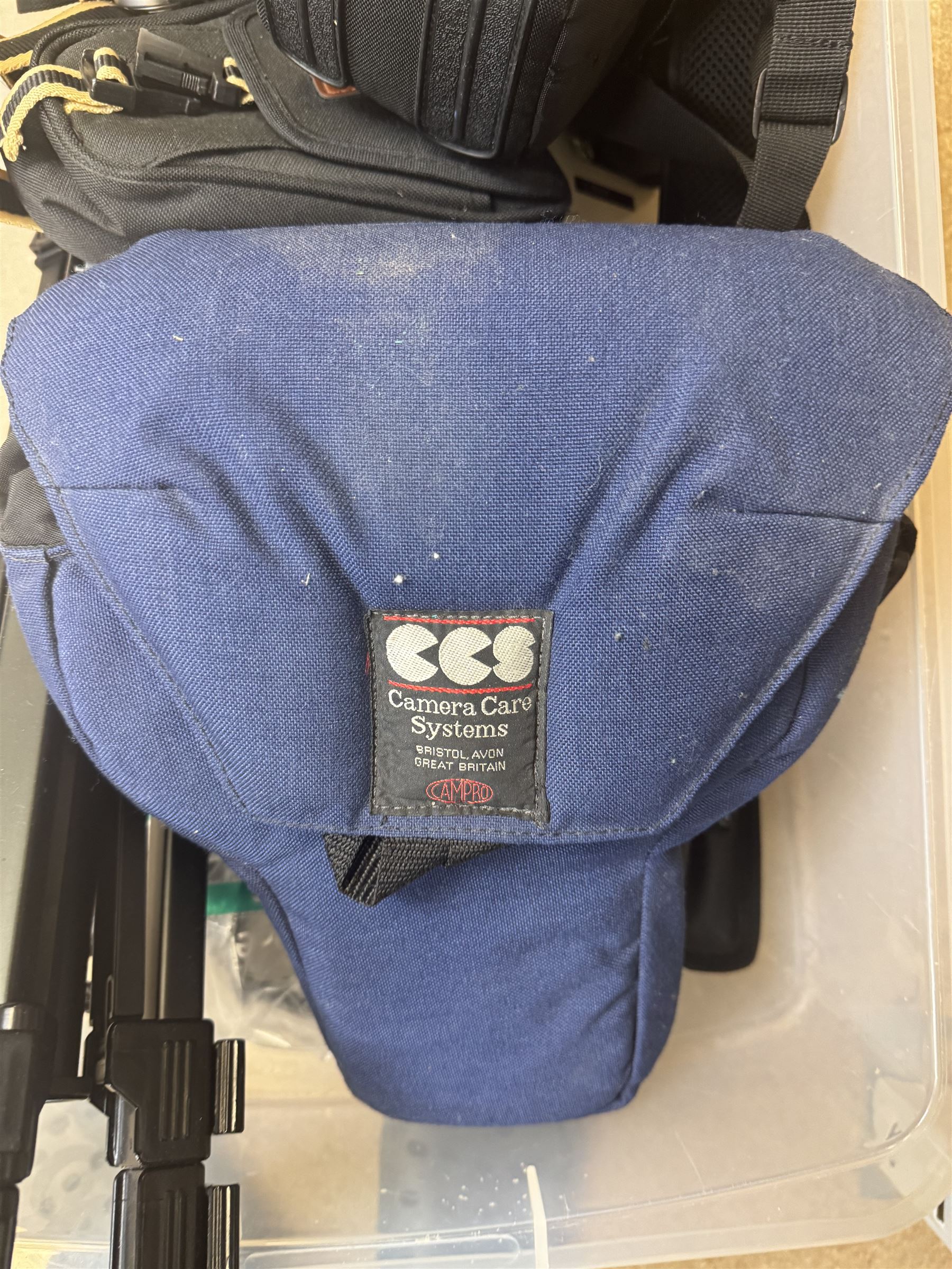 Collection of cameras and camera equipment, including Voigtlander Vitomatic I, Nikon Coolpix P340, Nikon Coolpix S9100, Olympus SP-510UZ, tripod, cases, etc