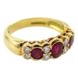 18ct gold three stone oval ruby and eight stone round brilliant cut diamond ring, London 2008