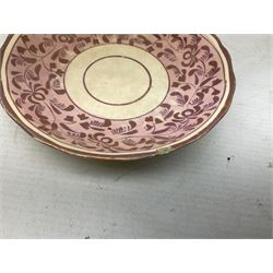 Three 19th century porcelain pink lustre teacups, together with two other saucers 