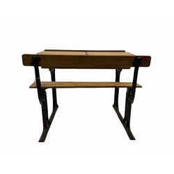 Early 20th century school desk, pine and cast iron, two sectional with hinged lids, the irons marked ‘Addision Ltd.’