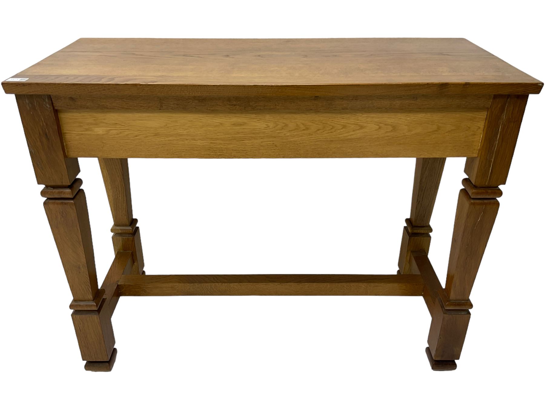 Solid oak console table, rectangular top raised on turned square supports united by stretcher