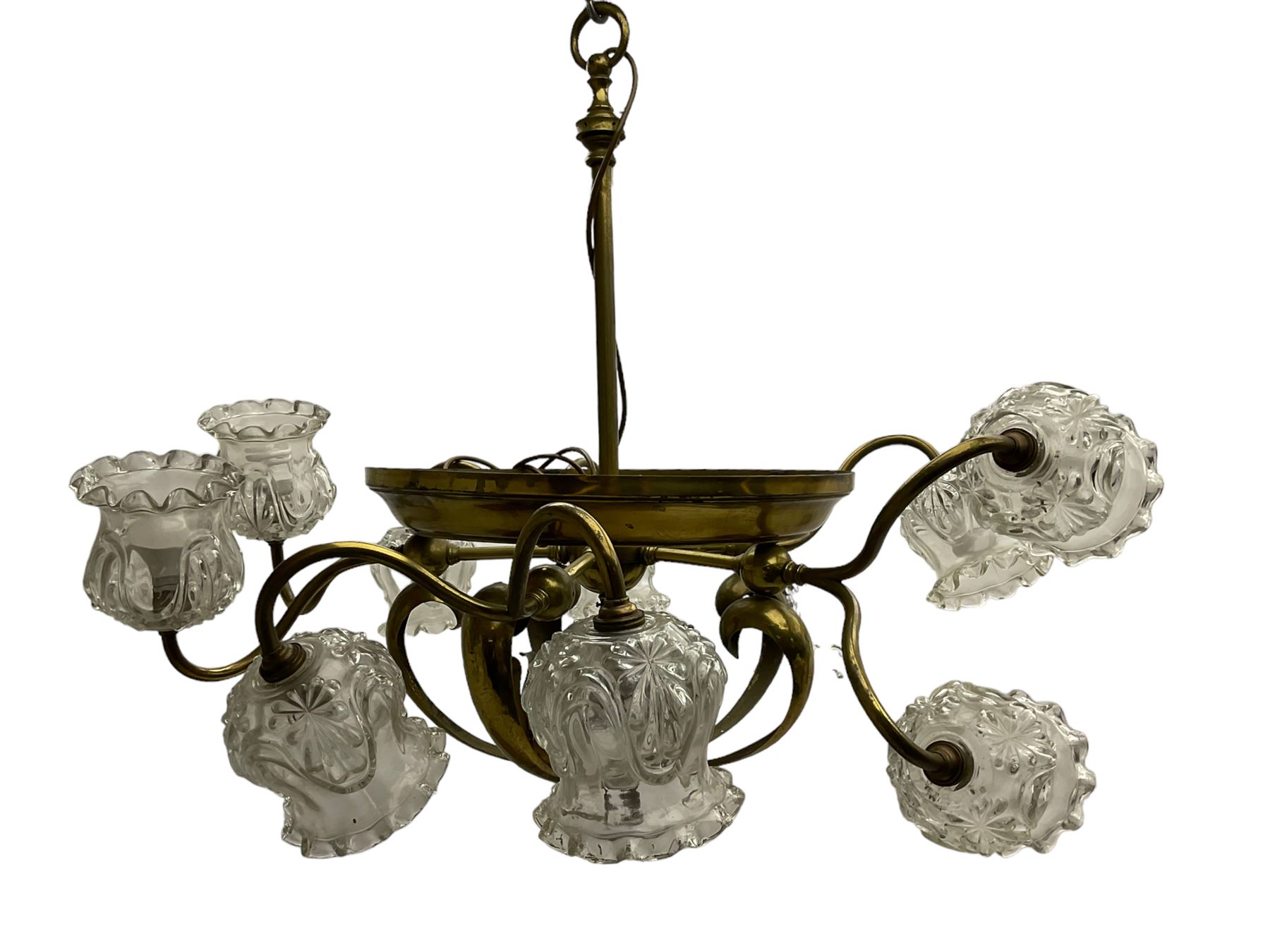 Mid-20th century brass lightolier or light fitting, the scrolling foliate branches connected with a central ring, terminating in ten tulip shaped cut glass sades, pointed terminal beneath