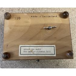 20th century burr wood Swiss musical box, marbled beneath 'made in Switzerland', paper label inscribed 'Around the world The Lass of Richmond Hill', H6.5cm W12.5cm D9cm