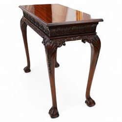 Georgian design mahogany console or side table, moulded rectangular top over palmette carved frieze, decorated with scrolling leafage, shell and bell flower carved cabriole supports with ball and claw feet 