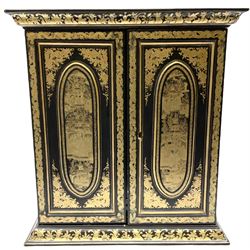 Early 20th century Oriental black lacquered chest of small proportions, fronted by double doors concealing six drawers with ivory handles, decorated in gilt with figures and buildings, H42.5