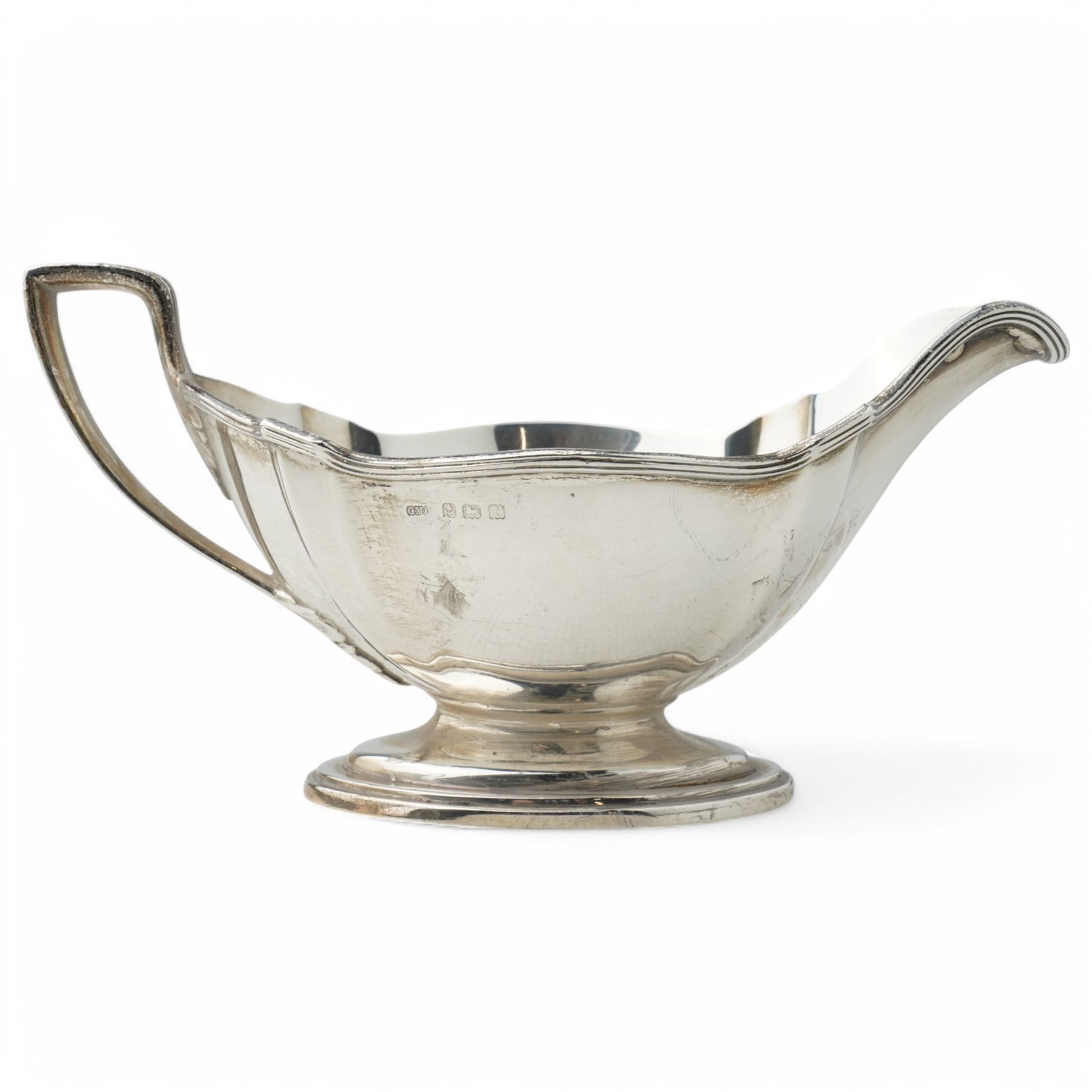 Pair of silver sauce boats with crimped reeded rims, angular handle and on pedestal foot Birmingham 1916 Maker Gorham Manufacturing Co.