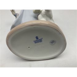 Three Lladro figures, comprising Dear Santa no 6166, Angelic Melody 1993 no 5963 and Seraphs Head no2 no 4885, together with Lladro plaque Love Brings Us Together no 7677, all with original boxes, largest example H18cm