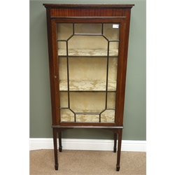  Edwardian mahogany narrow display cabinet, projecting cornice, astragal glazed door enclosing two shelves, square tapering legs, spade feet, W61cm, H140cm, D32cm  