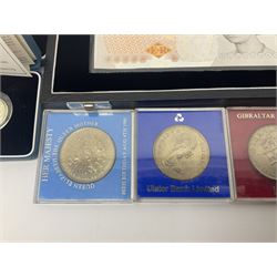 The Royal Mint United Kingdom 'Millennium' silver proof two coin set comprising 1999 and 2000 five pound coins, 2000 'The Queen Mother Centenary Year' silver proof crown, 2001silver proof one pound, 'Her Majesty The Queen Golden Jubilee 1952-2002' silver proof 2002 five pound coin and ten pound banknote set, all being cased with certificates, United Kingdom 1999 brilliant uncirculated coin collection in card folder, other commemorative coinage etc