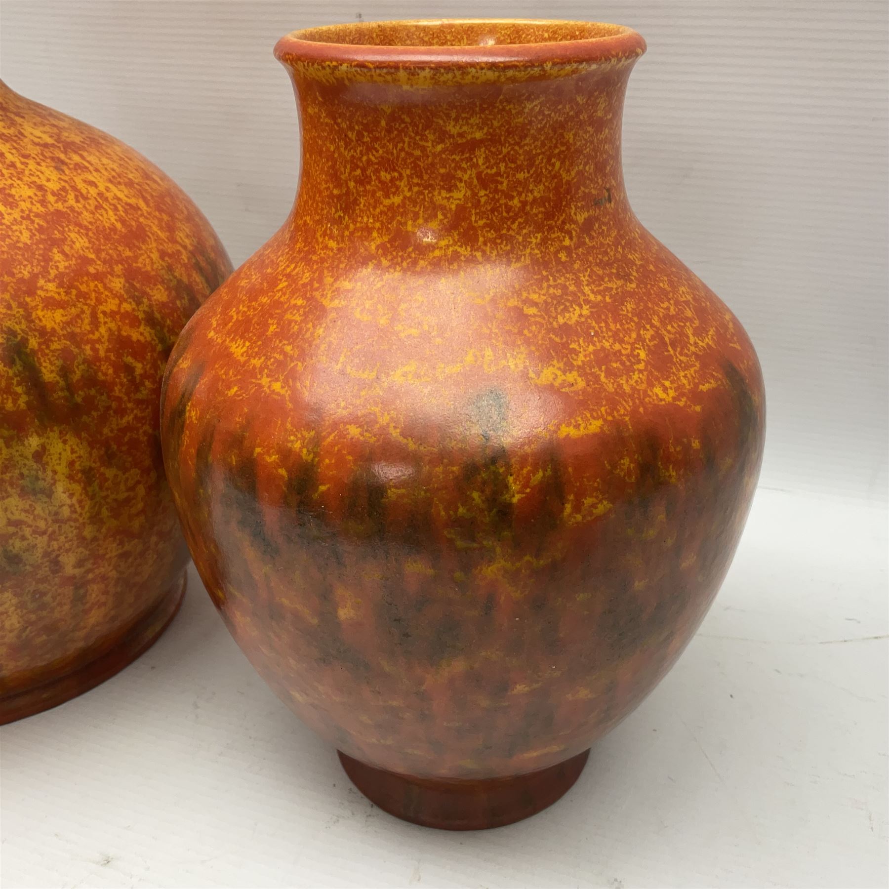 Two Pilkington's Royal Lancastrian vases of baluster form decorated in orange Vermillion, larges H27cm