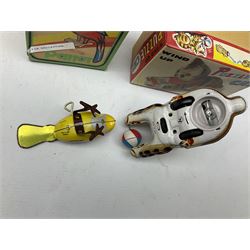 Seven modern Chinese, Japanese and Continental boxed tin-plate toys including Ucan Daire Flying Saucer, Drumming Animal, Circus Clown, Puzzle Cat, Bird with Jumping Action etc; and a quantity of clockwork toy keys (7)
