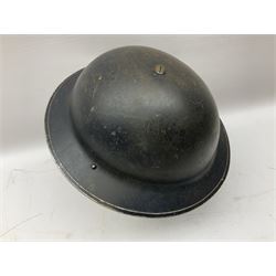 WW2 Home Front 'Police' black painted steel helmet with original liner and webbing chin strap, impressed R.O. Co. 1/1939; and re-painted shell only for WW2 Wardens steel helmet impressed AMC II 1941 C676 (2)