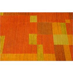 Vintage handwoven modernist rug with cubist design in contrasting tones of amber and orange