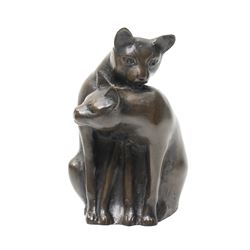 Two Seneshall bronzed resin cats, signed, W21cm and 23cm; together with a bronze effect mother and kitten , H10cm (3)