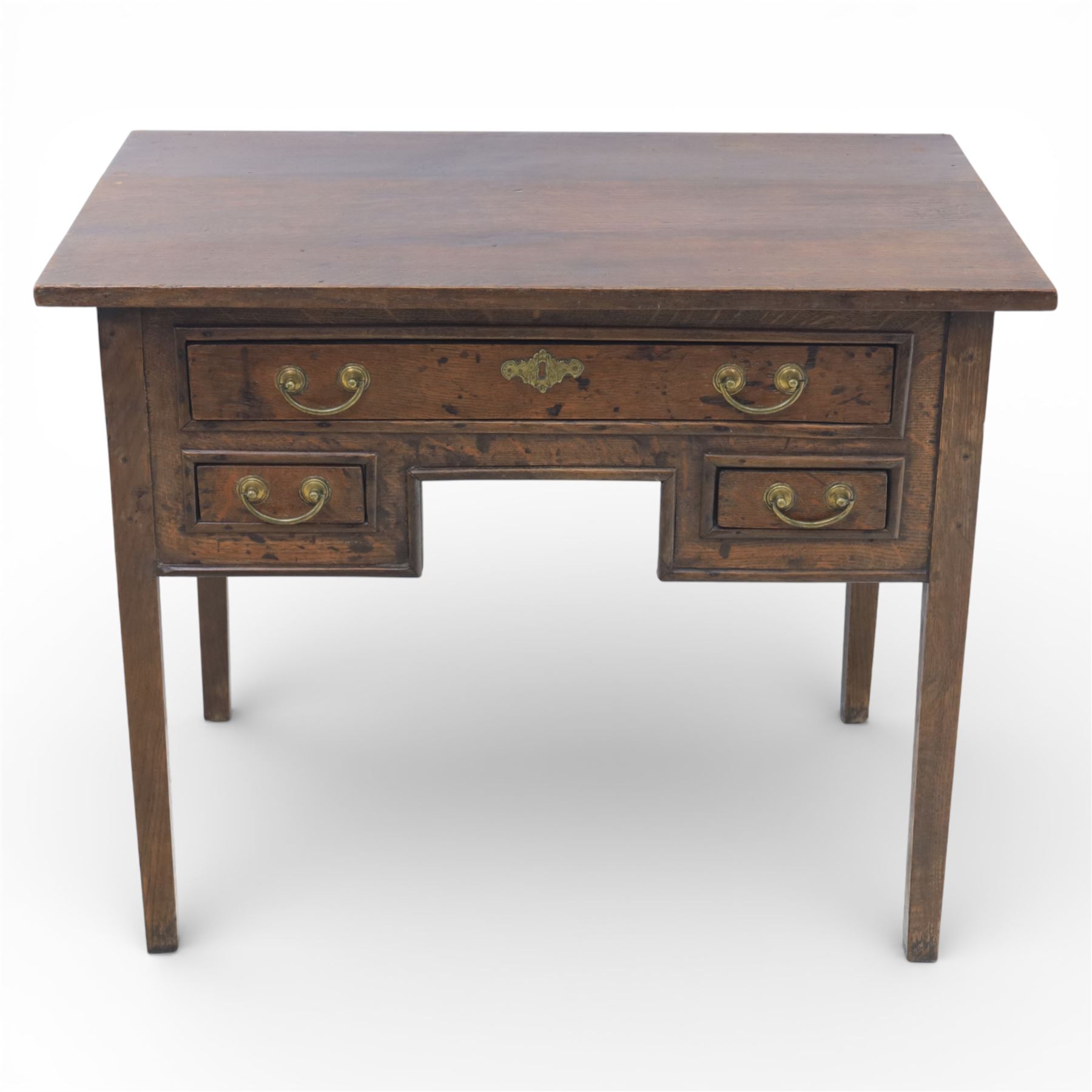 18th century oak lowboy, the rectangular top above an arrangement of three drawers with brass swan neck handles and shaped backplates, the drawers with fielded fronts, raised upon square tapering legs 
