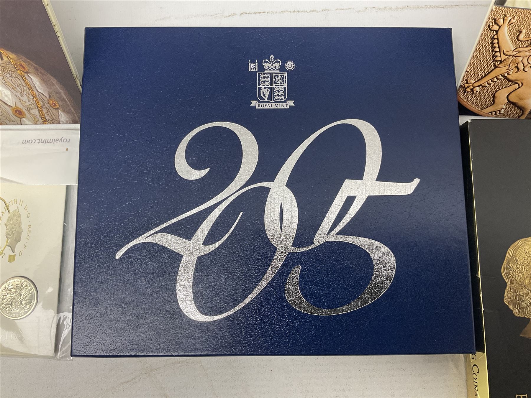 The Royal Mint United Kingdom 2005 proof coin set, with certificate, 2009 'Henry VIII' brilliant uncirculated fine pound coin, 2010 brilliant uncirculated coin collection, 2015 'The Fourth and Fifth Circulating Coinage Portrait Collection', and 'Farewell and Nations of the Crown UK' one pound brilliant uncirculated two coin set, all cased or in card folders