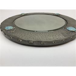 Arts & Crafts style circular hammered pewter mirror inset with four turquoise cabochons, D27.5cm