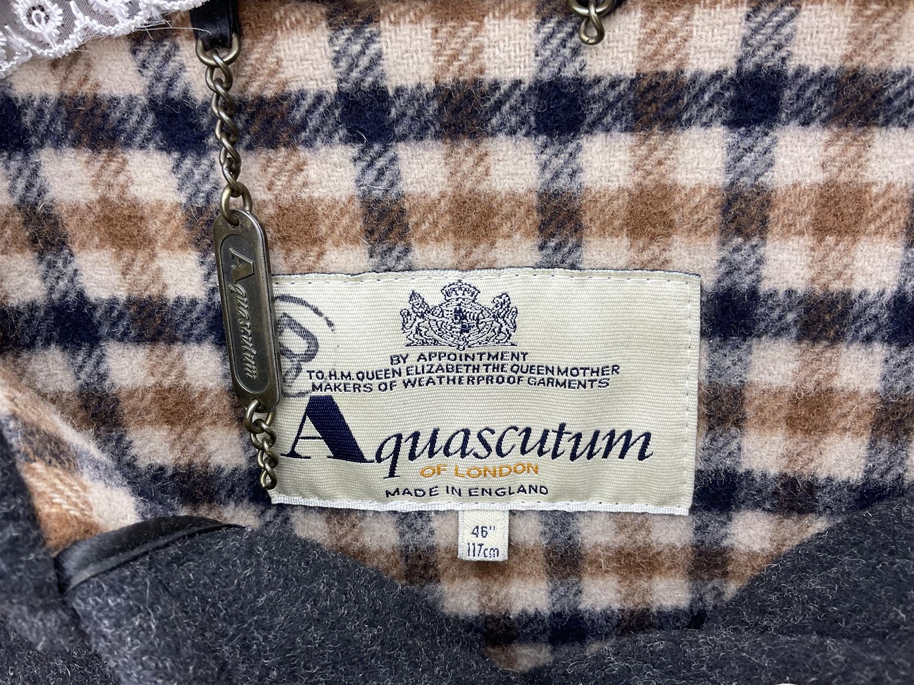 Men's Aquascutum lambs wool herringbone tweed coat with silk lining, 46 Reg, together with a further Men's Aquascutum grey wool duffle coat, with cheque lining and horn buttons, 46