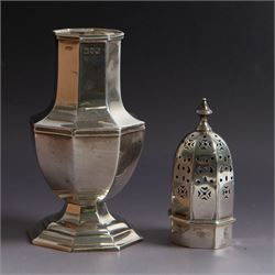 Edwardian silver sugar caster, of octagonal urn form, upon an octagonal foot, the removable pierced cover with urn finial, hallmarked Charles & George Asprey, London 1909, H21cm 