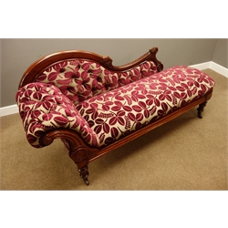  Late Victorian walnut framed chaise longue, scrolled buttoned back with carved detail, upholstered in floral fabric, turned supports with ceramic castors, L193cm  