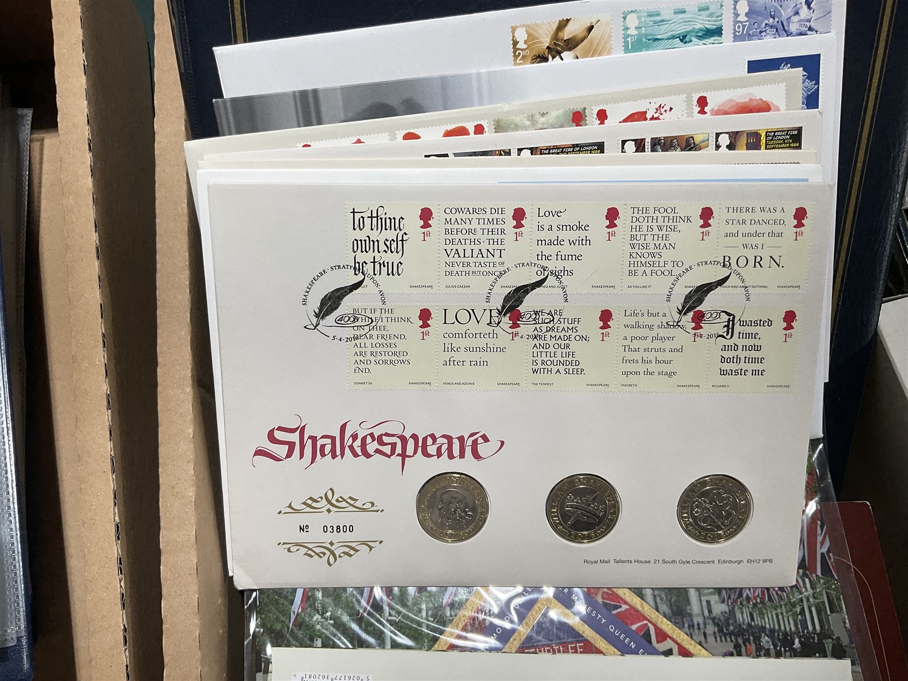 Approximately one hundred and fifteen Royal Mint coin covers, in two ring binder folders and loose, together with approximately 53 grams of Great British pre-1920 and approximately 68 grams of Great British pre-1947 silver threepence coins, and a small quantity of further pre-decimal coins