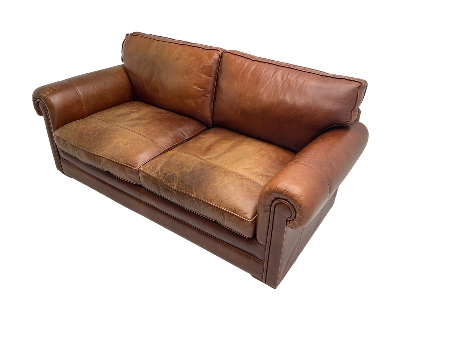 Large two seat sofa upholstered in tan 'Derwent' leather (W200cm D100cm H85cm), and matching armchair (W95cm)