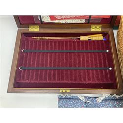 Collection of lace making wooden bobbins, together with lace making books and a handmade storage box