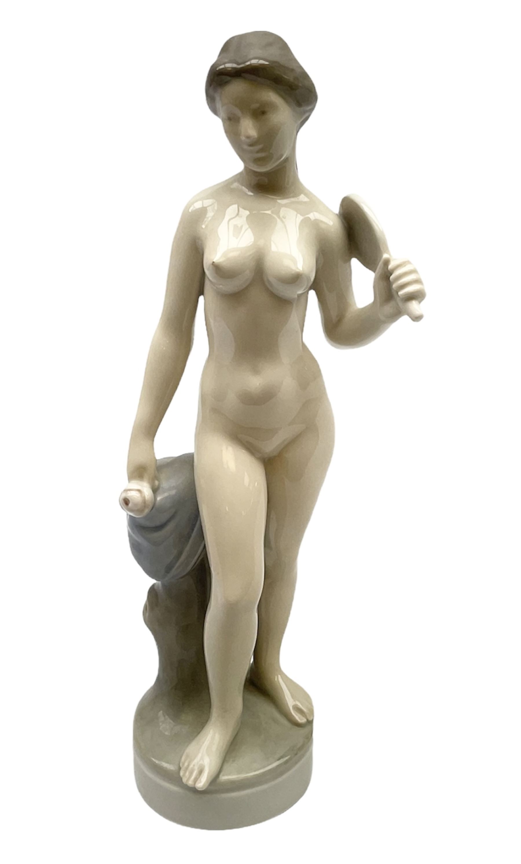 Royal Copenhagen 'Helena' figure modelled as a nude girl holding hand mirror, designed by Hans Hansen, model no. 4639, with printed and painted marks beneath, H25.5cm