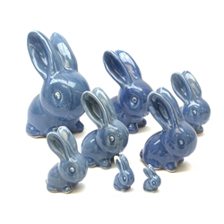 A collection of eight Denby blue glazed models of the Rabbits Marmaduke and Cotton tail, various sized, largest H20.5cm, some marked.
