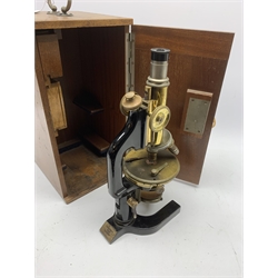  Reichert Wien Late 19th century brass and black japanned monocular microscope stamped C.Reichert Wien, No.48054, coarse and fine adjust, circular stage on horseshoe base, with three ocular and five objective lenses, in fitted mahogany case   