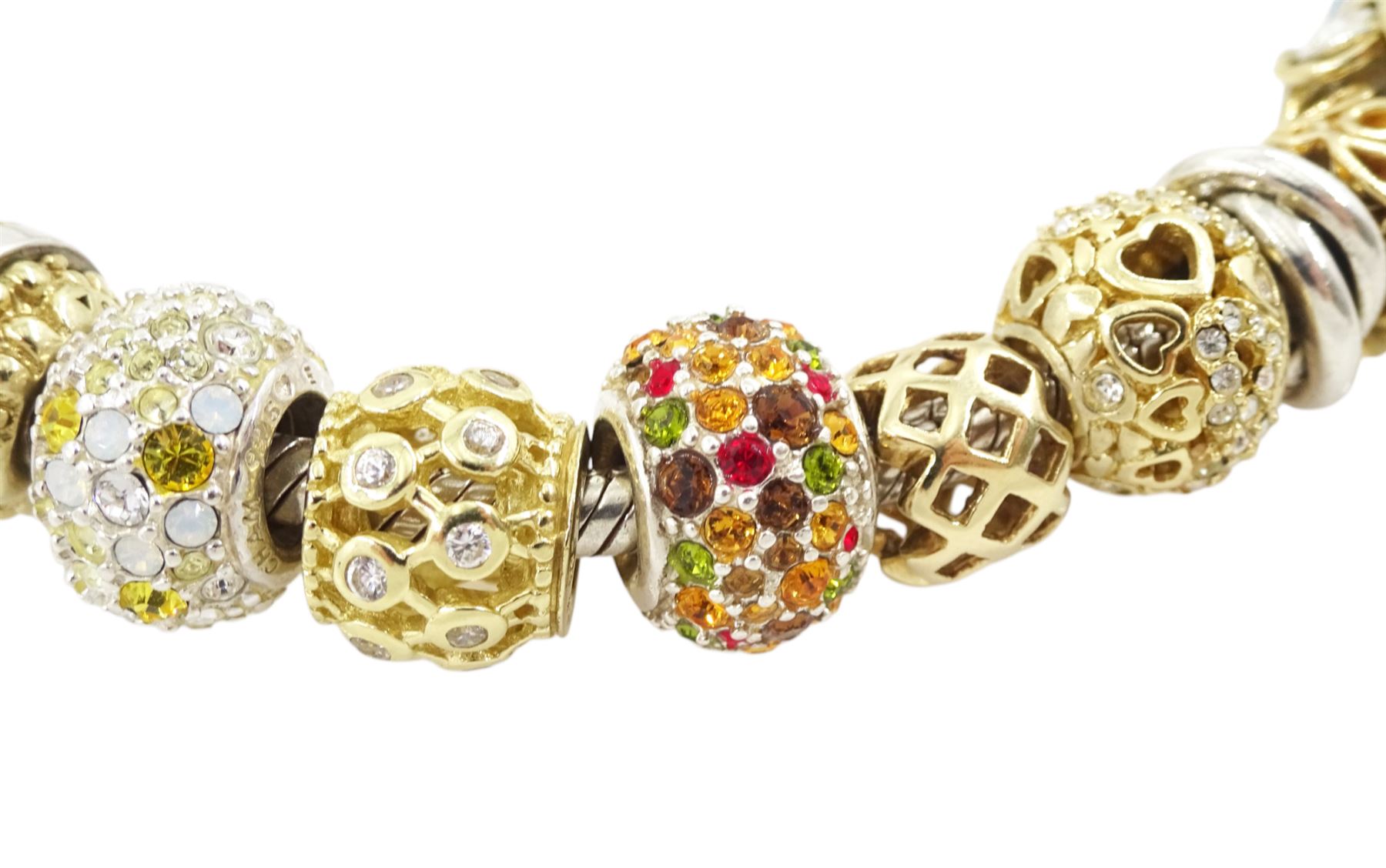 Chamilia 14ct gold and silver charm bracelet, silver bracelet, with 14ct gold and silver finials, six 14ct gold charms including cubic zirconia, four silver charms and two silver and 14ctgold charms, boxed