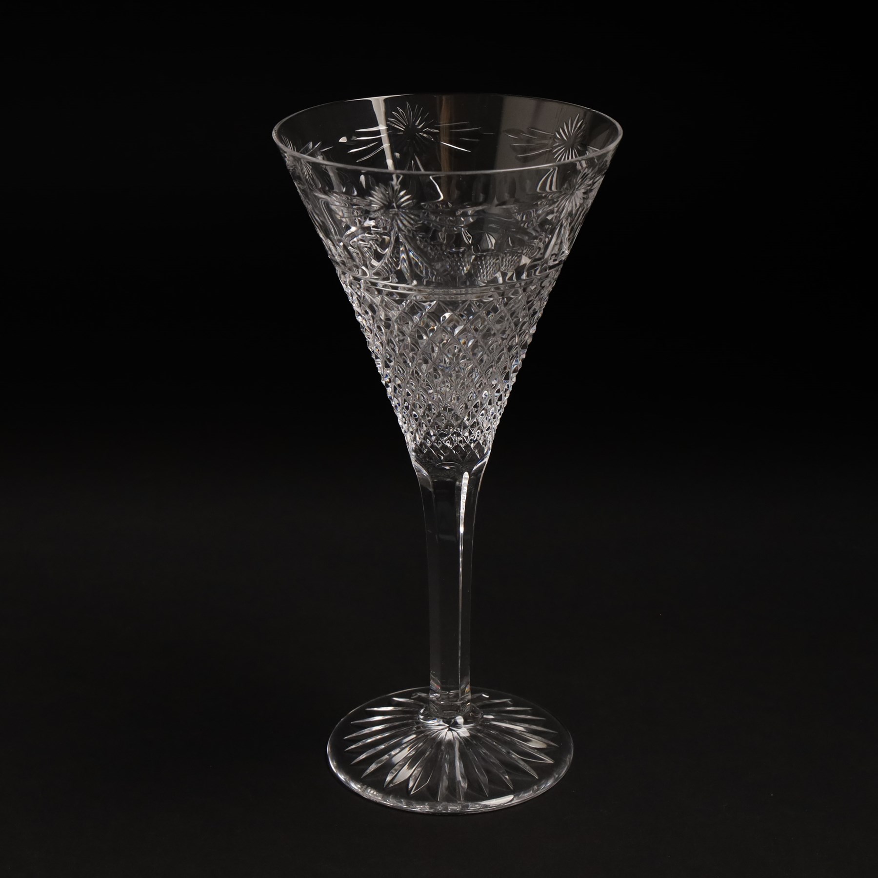  Suite of Stuart crystal Beaconsfield pattern table glass, comprising 6 claret glasses, 6 white wine glasses, 6 dessert wine glasses, 6 brandy balloons, 6 champagne flutes, and 9 whisky glasses