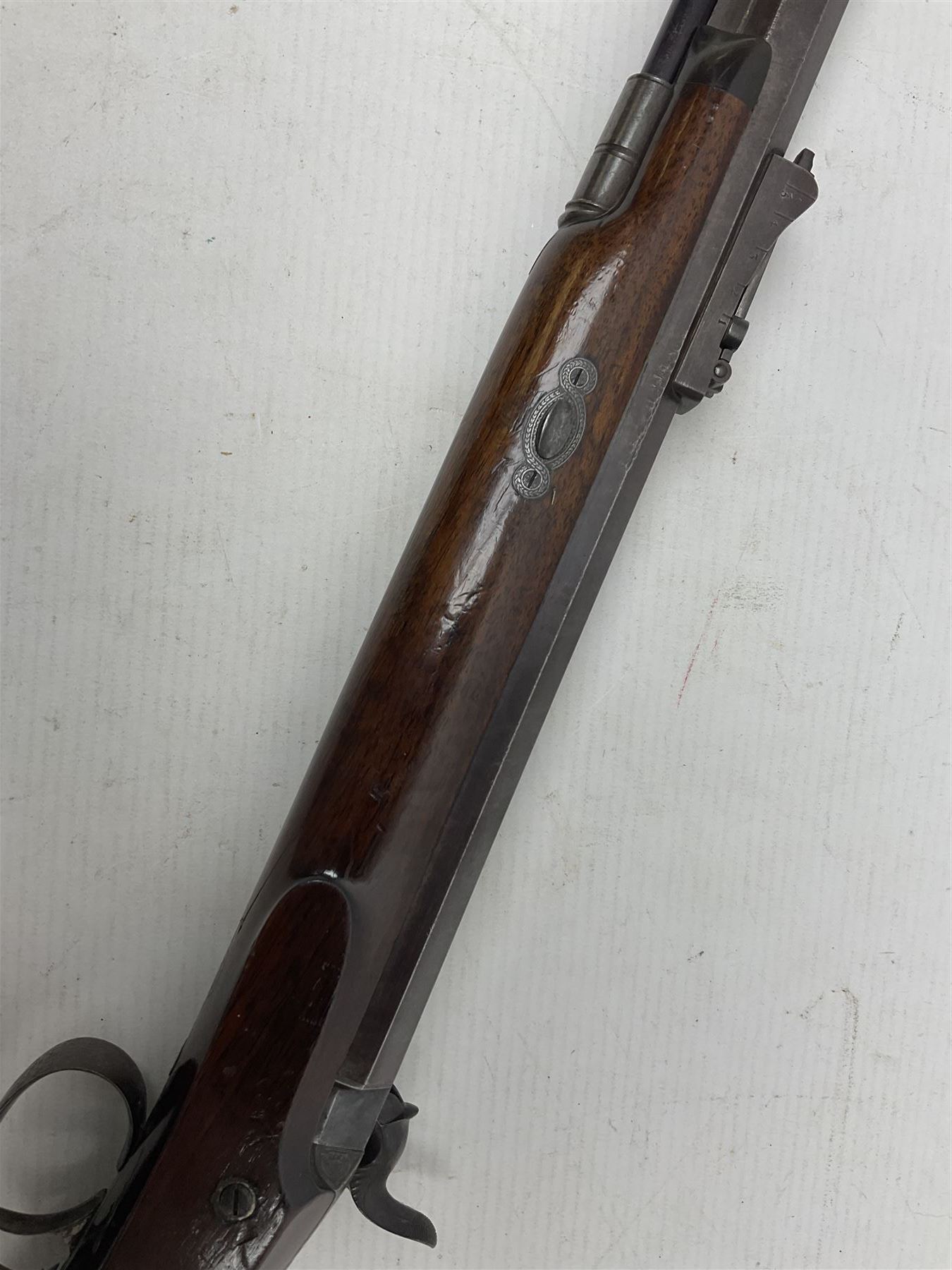 Mid-19th century percussion rifle by Geo. Forrest & Sons of Jedburgh No.844, 79cm octagonal barrel (approx .45 bore) with folding foresight, the lock plate with dolphin hammer finely engraved with a tiger and a stag, trigger guard engraved with hounds chasing a stag, figured walnut half stock with chequered grip and original ramrod 121cm overall; with framed photograph of original owner Dr. A.B. Dresser and archive of related ephemera including manuscript letter from the makers to Dr. Dresser regarding the sight specifications.