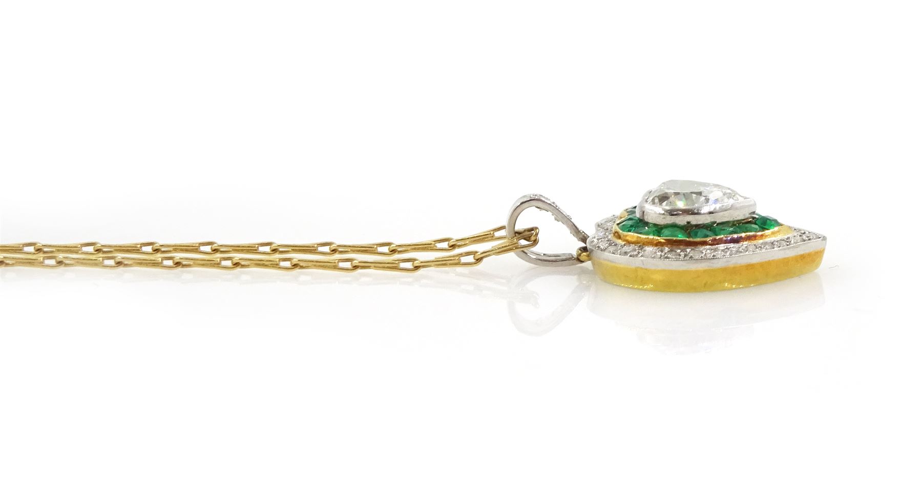 15ct gold and platinum diamond and emerald heart pendant, the principal milgrain set,  heart cut diamond of approx 1.00 carat, with calibre cut emerald and round cut diamond surround, on an 18ct gold fancy link chain necklace, hallmarked