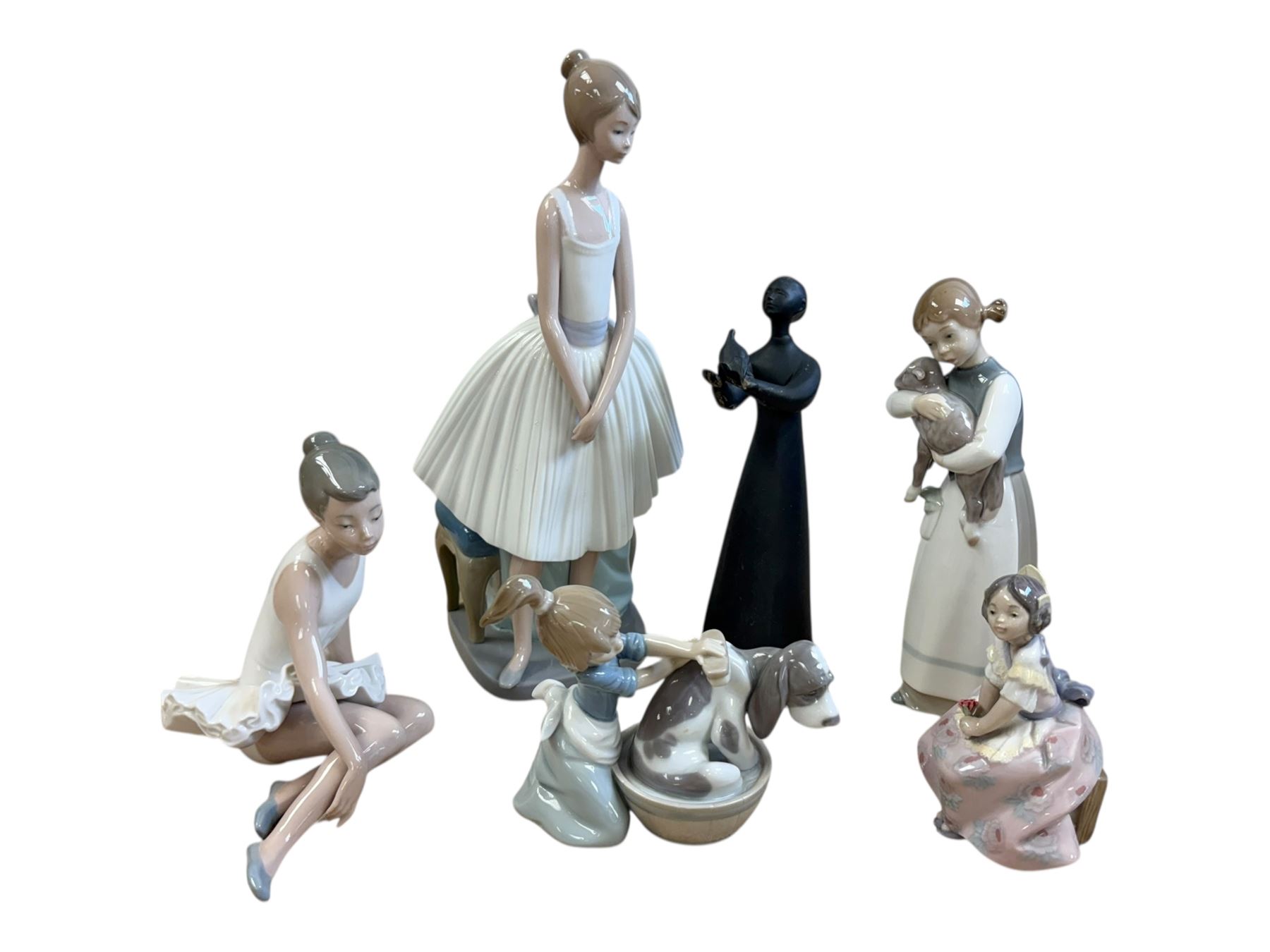 Three Lladro figures, Bashful Bather 5455, Pepita no 5372 and girl with lamb no 1010, together with two Neo figures and a Royal Doulton figure 