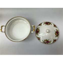 Royal Albert Old Country Roses part dinner and tea service comprising teapot, four tea cups and saucers, eight dessert plates, cake plate, cake stand, a tureen with cover, six dinner plates, an oval dish, two trinket dishes, bell and shoe decoration. 