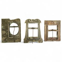 Newlyn type Arts and Crafts copper photograph frame decorated with a fish and galleon 24cm x 20cm with oval aperture and two other Newlyn style beaten copper frames (3)